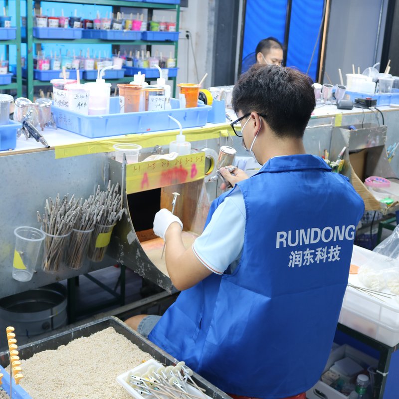Spray painting and pad printing lines.